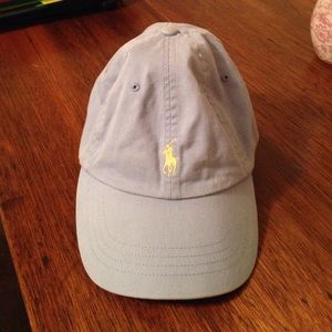 Baby blue Polo hat with yellow Polo symbol.