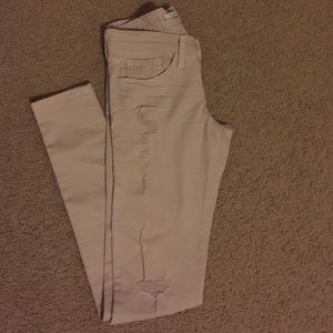 Light khaki distressed super skinny jeans