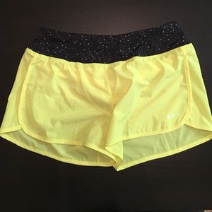 Neon yellow Nike running shorts