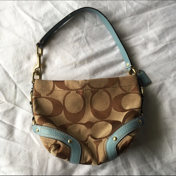 Authentic Coach print bag with baby blue details.
