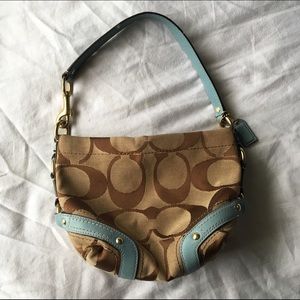 Authentic Coach print bag with baby blue details.