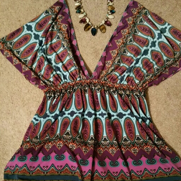 V neck blouse.  It will fit a medium size also.