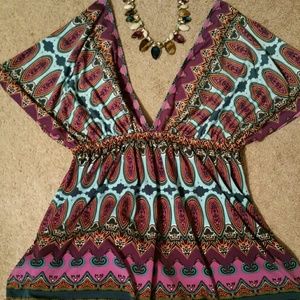 V neck blouse.  It will fit a medium size also.