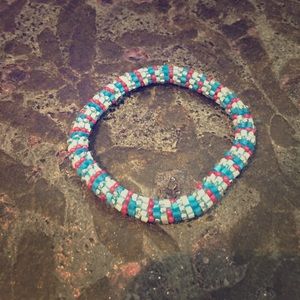 New red and blue beaded bracelet made in Nepal.