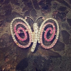 Pink and silver butterfly brooch.