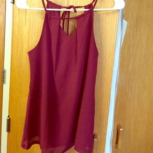 Maroon flowy tank with open slit in front and back