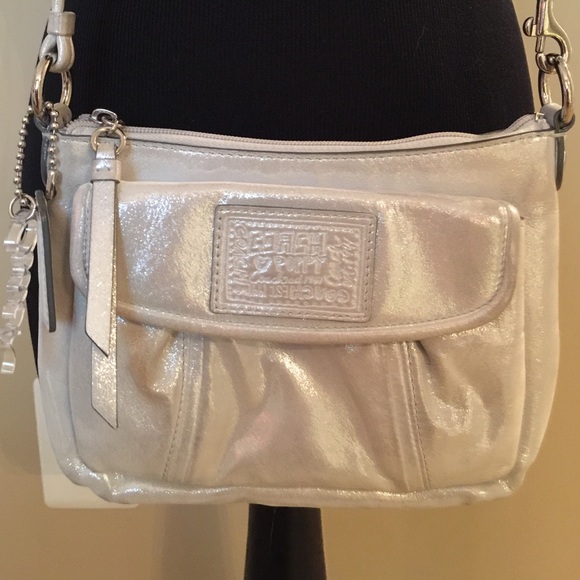 Coach Handbags - Coach silver cross body bag w/front pocket