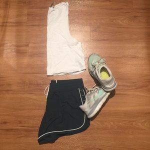 Dark forest green Under Armour fitness shorts.