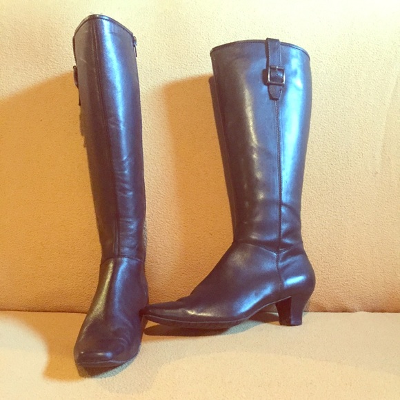 Tall black leather boots with heel