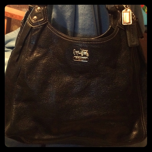 Coach bag with lots of room to organize.