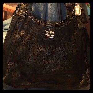 Coach bag with lots of room to organize.