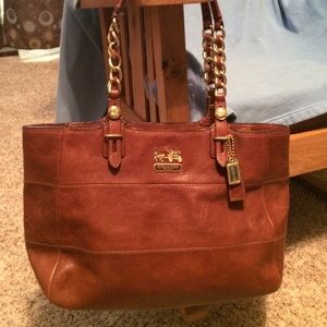 Brown leather shoulder bag.