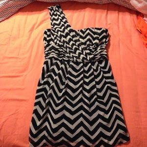 One shoulder strap, black and white striped dress.