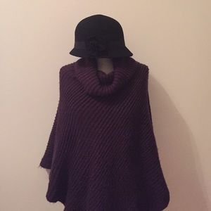 100% Wool Hat with flower accent.