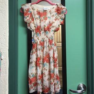 White/cream dress with red and blue flower pattern