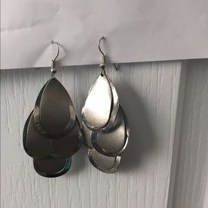 Silver tear drop dangle fashion earrings .