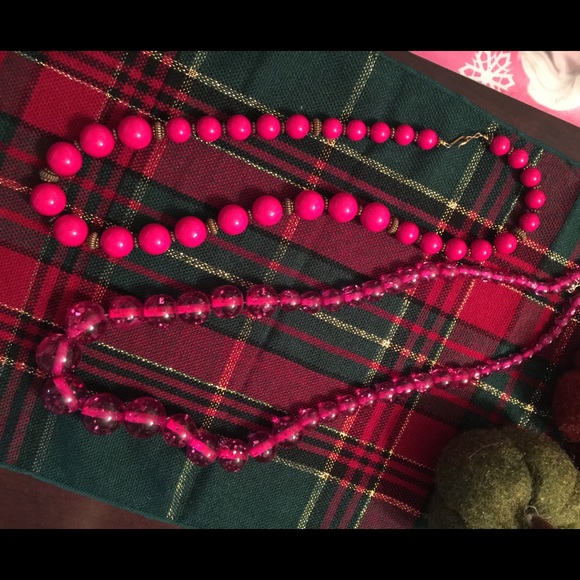 Pink bead necklaces both plastic