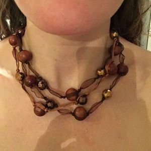 Brown and gold beaded necklace with ribbon