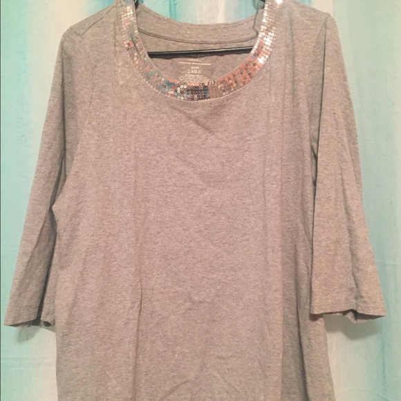 grey top with silver shiny neckline