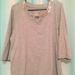 grey top with silver shiny neckline