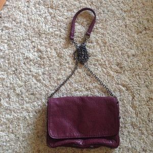 Small Burgundy studded clutch with shoulder strap