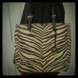 Authentic Michael Kors canvas and leather tote.