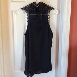 Nella Fantasia black lace halter neck crop top.