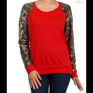 Red sweater with gold toned sleeves.