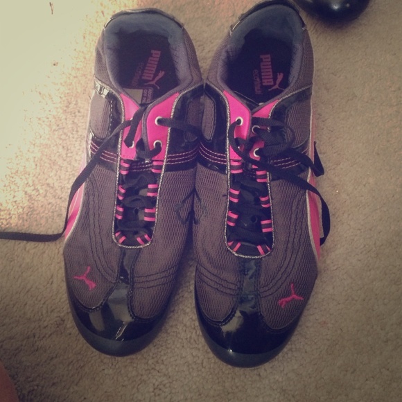 Pink and black Puma running shoes