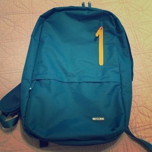 EUC Incase laptop backpack in teal/yellow