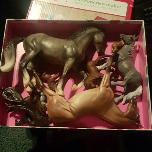 Box of plastic horses