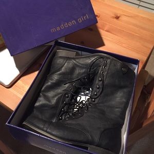 Tall black combat boots