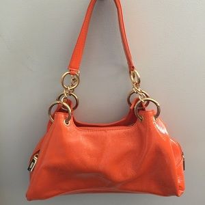 Orange patent leather Hobo brand purse