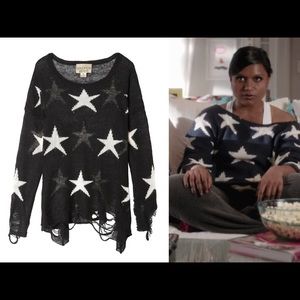 Black star sweater with ripped hem