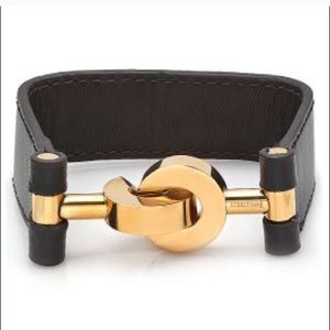 Cool and edgy leather bracelet with gold hardware