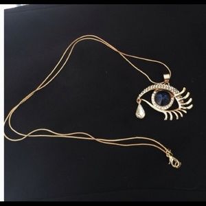 Gold tone evil eye pendant