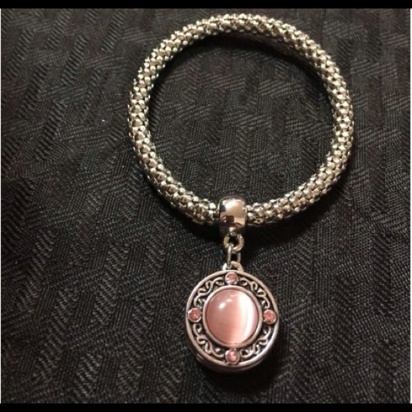 Gold tone charm bracelet.