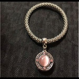 Gold tone charm bracelet.