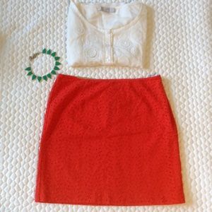 Orange eyelet mini skirt