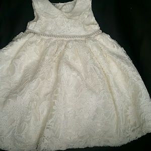 look lovely in lace with this timeless baby dress