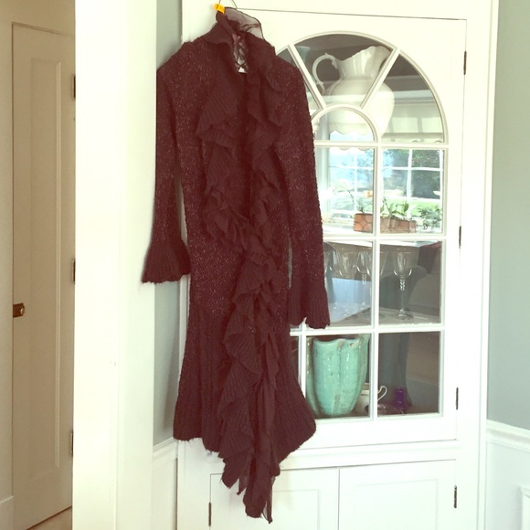 Long brown sweater with lace details.