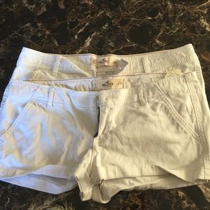 2 pairs of white Hollister shorts.