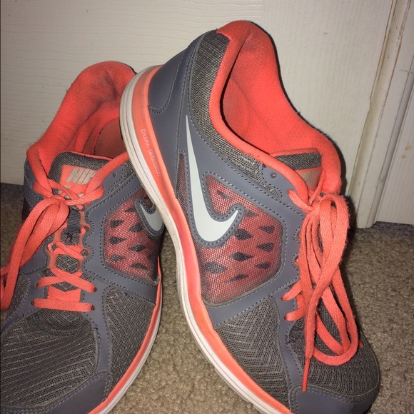Orange Nike tennis shoes