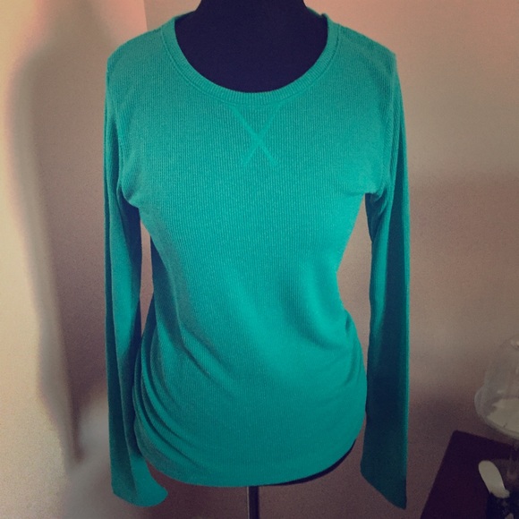 Under ARMOUR style shirt. Never been worn.