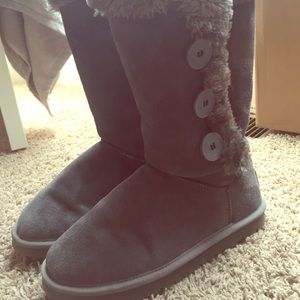 Tall grey boots with buttons on the side