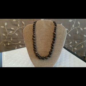 Dark wood beaded necklace with silver toggle clasp