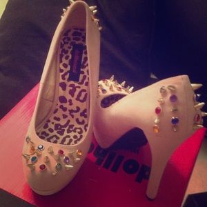 Spiked and rhinestone covered pumps
