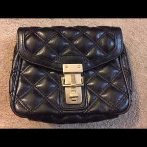 Quilted metallic black mini crossbody purse.