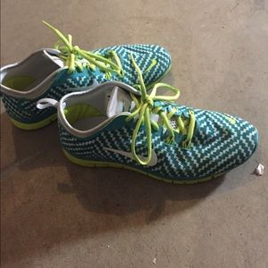 Green and blue nike free running shoes