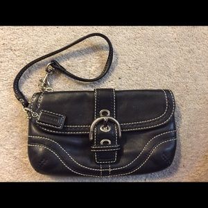 Authentic Coach leather wristlet.